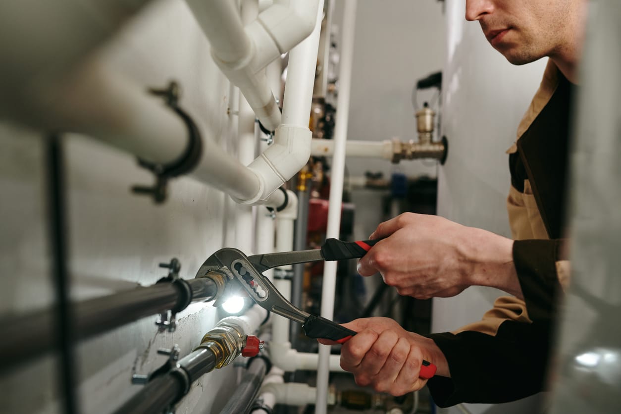 Plumbers maintaining commercial plumbing pipes in Deltona