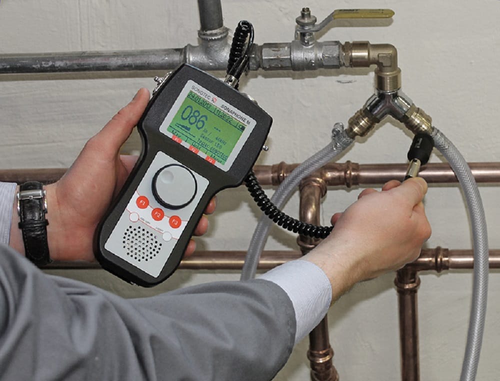 Plumber testing pipes with electronic leak detection equipment in Deltona