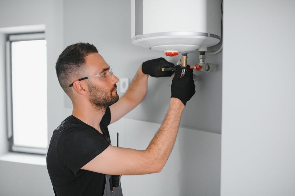 Technician performing water heater maintenance in Deltona